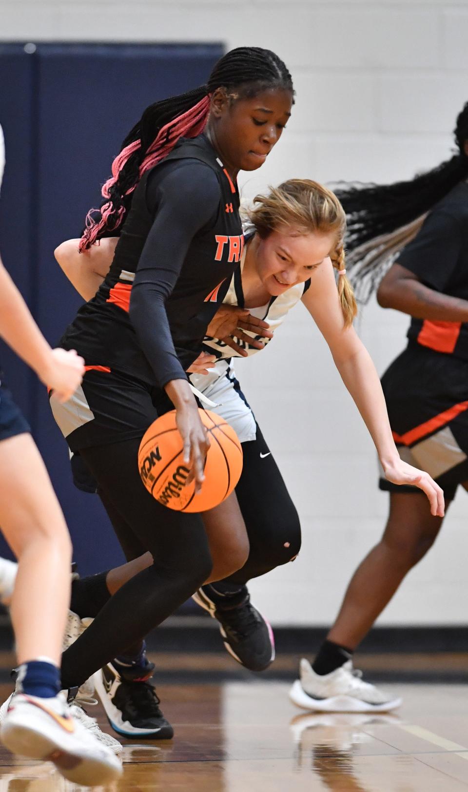 Parrish's Sarah Decker (#32) tries to steal the ball from Lely's Fara Louissaint (#11). Parrish Community High School hosted Lely High School in the Class 5A Region 3 girls basketball playoff Monday night, Feb. 19, 2024