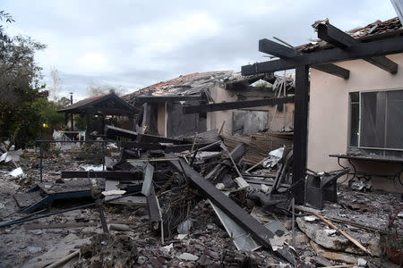 A damaged house that was hit by a rocket can be seen north of Tel Aviv, Israel, March 25, 2019. REUTERS/Yair Sagi