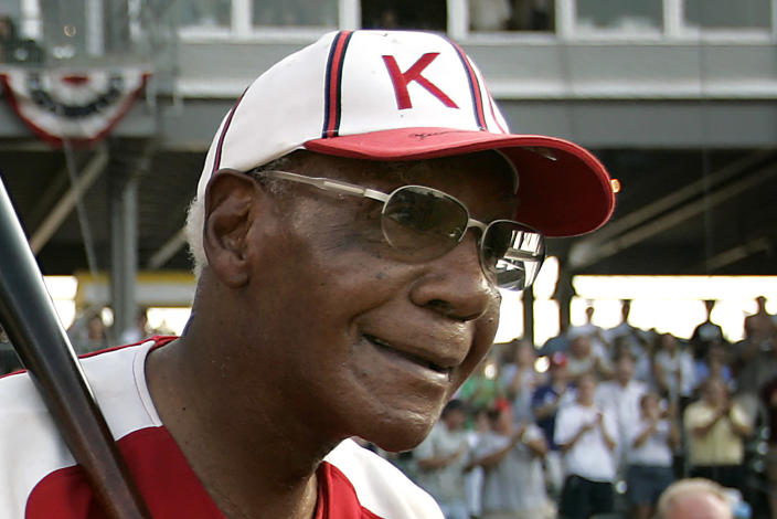 FILE - Buck O'Neil walks to the field as he is introduced before a minor league all-star game Tuesday, July 18, 2006, in Kansas City, Kan. O'Neil will be posthumously inducted into the Baseball Hall of Fame on Sunday, July 24, 2022. (AP Photo/Charlie Riede, File)