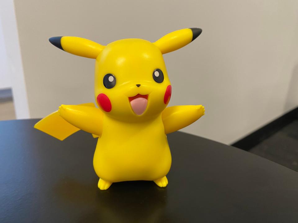 Pikachu lights up and moves his arms and ears when you press one of his three sensors on his head, nose, and belly.