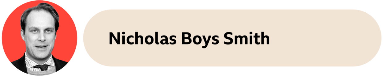 A beige box with the words Nicholas Boys Smith written on it. Nicholas' face is in an orange circle on the left side. 
