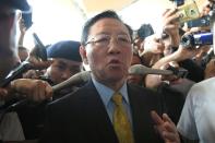 Expelled North Korean ambassador to Malaysia Kang Chol speaks to journalists outside the departure hall of the Kuala Lumpur International Airport in Sepang on March 6, 2017