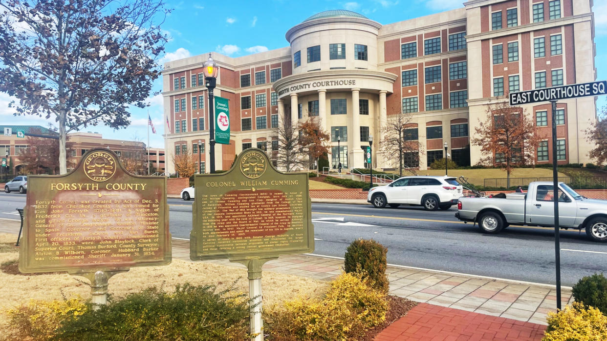 Signs at the Cumming town square detailing the history of the county and Col. William Cumming. The signs sit across the street from the Forsyth County Courthouse. 