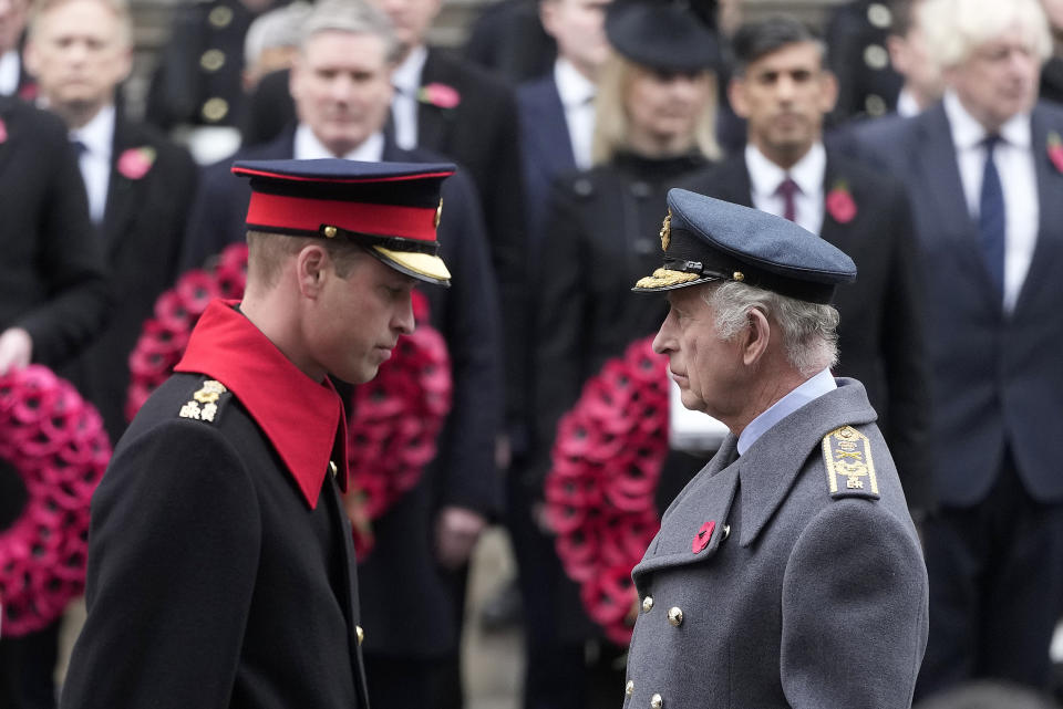 FILE - Britain's King Charles III and Prince William attend the Remembrance Sunday service at the Cenotaph on Whitehall in London, Sunday, Nov. 12, 2023. King Charles III has been diagnosed with a form of cancer and has begun treatment, Buckingham Palace said Monday Feb. 5, 2024. Less than 18 months into his reign, the 75-year-old monarch will suspend public duties but will continue with state business, and won't be handing over his constitutional roles as head of state. (AP Photo/Kin Cheung, Pool, File)