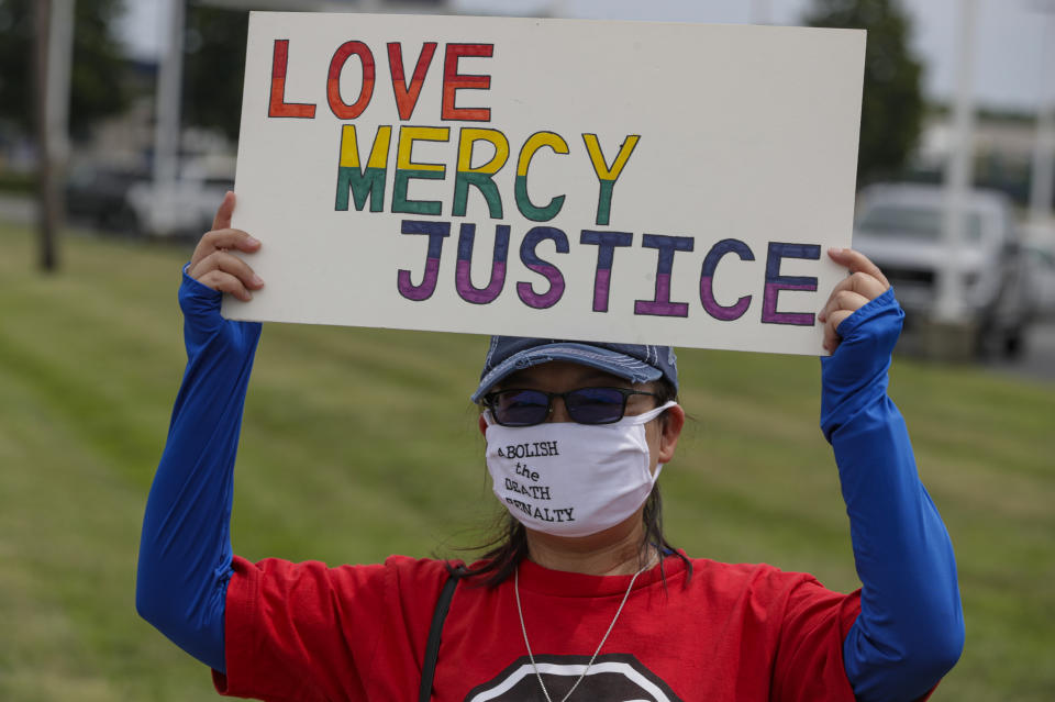 Protesters against the death penalty gather in Terre Haute, Ind., Wednesday, July 15, 2020. Wesley Ira Purkey, convicted of a gruesome 1998 kidnapping and killing, is scheduled to be executed Wednesday evening at the federal prison in Terre Haute. (AP Photo/Michael Conroy)