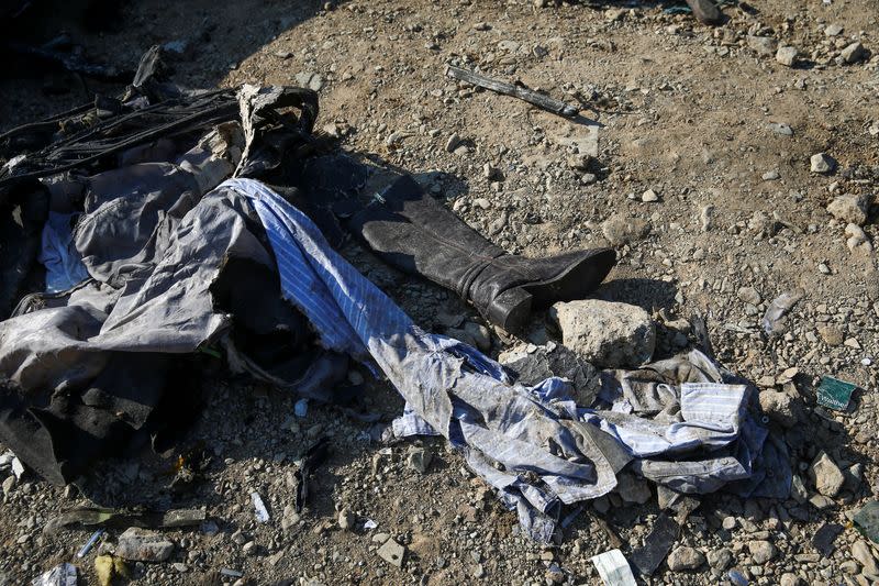 Passengers' belongings are pictured at the site where the Ukraine International Airlines plane crashed after take-off from Iran's Imam Khomeini airport, on the outskirts of Tehran
