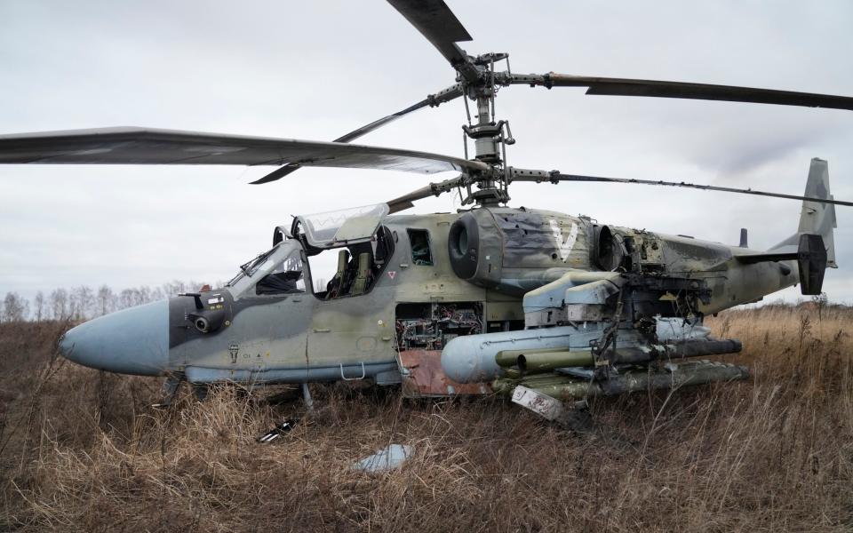 A Russian Ka-52 helicopter gunship is seen in the field after a forced landing outside Kyiv, Ukraine, in February 2022