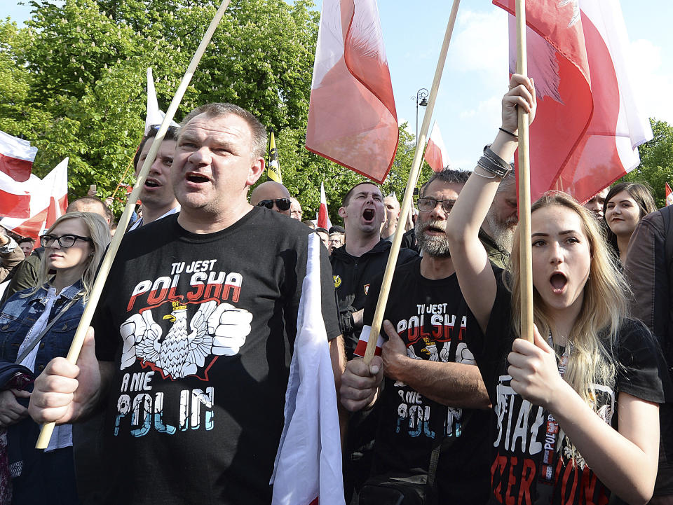 Thousands of Polish nationalists march to the U.S. Embassy, in Warsaw, Poland, Saturday, May 11, 2019. Thousands of Polish nationalists have marched to the U.S. Embassy in Warsaw, protesting that the U.S. is putting pressure on Poland to compensate Jews whose families lost property during the Holocaust. The protesters included far-right groups and their supporters. They said the United States has no right to interfere in Polish affairs and that the U.S. government is putting "Jewish interests" over the interests of Poland. The T-shirts read in Polish "This is Poland not Polin" (AP Photo/Czarek Sokolowski)