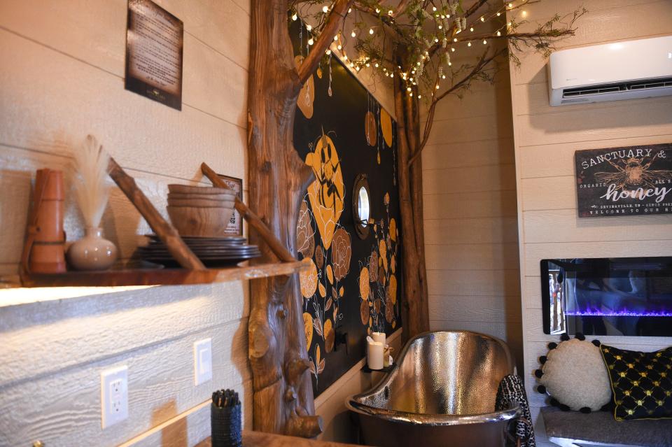 Each treehouse at the newly opened Sanctuary Treehouse Resort has its own special features and fixtures, such as this tub and fireplace.