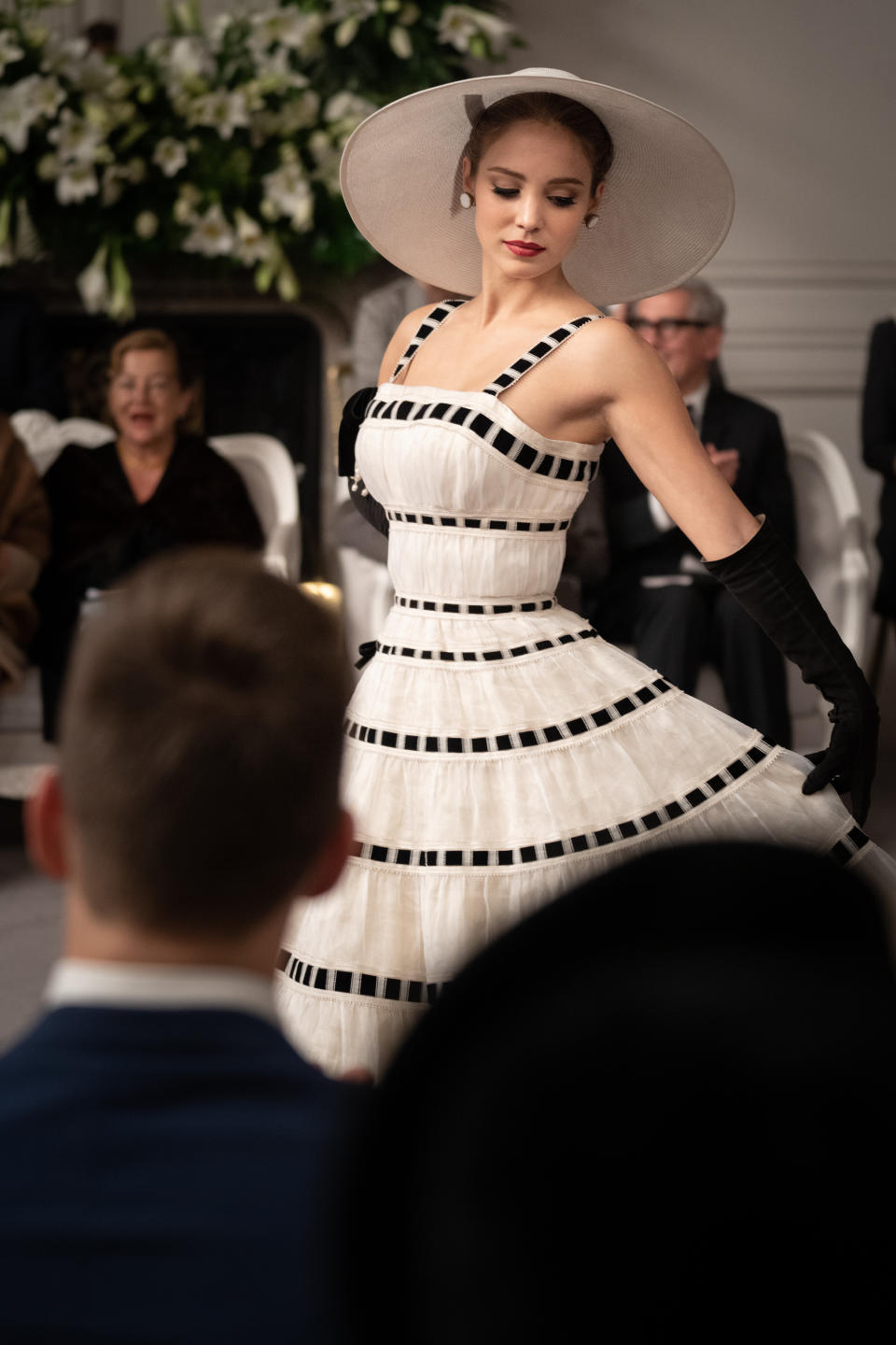 Alba Baptista stars as Natasha modeling the Vaudeville dress from the Christian Dior show in “Mrs. Harris Goes to Paris.” - Credit: David Lukacs