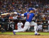 Sep 18, 2018; Phoenix, AZ, USA; Chicago Cubs shortstop Javier Baez hits a single in the fifth inning against the Arizona Diamondbacks at Chase Field. Mandatory Credit: Mark J. Rebilas-USA TODAY Sports