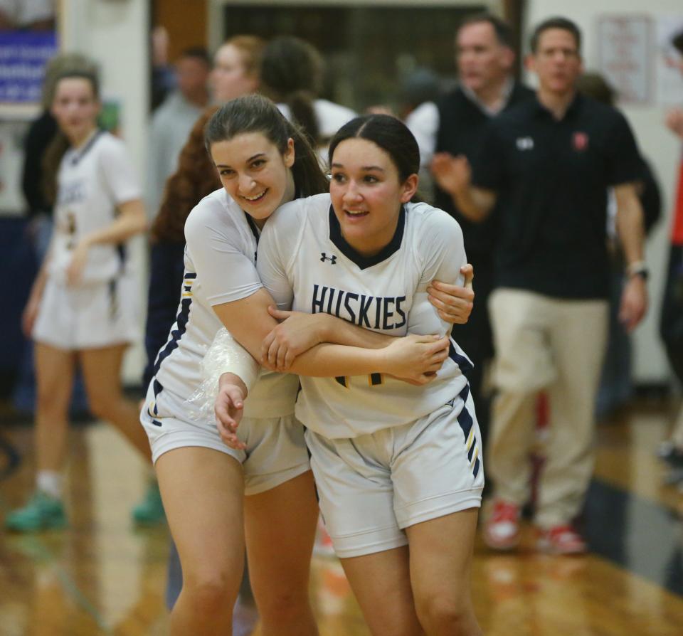 Highland's, from left, Marisa Piegari hugs Ciara Teamer acting winning the Section 9 Class B semifinal girls basketball game versus Onteora on February 27 2024.