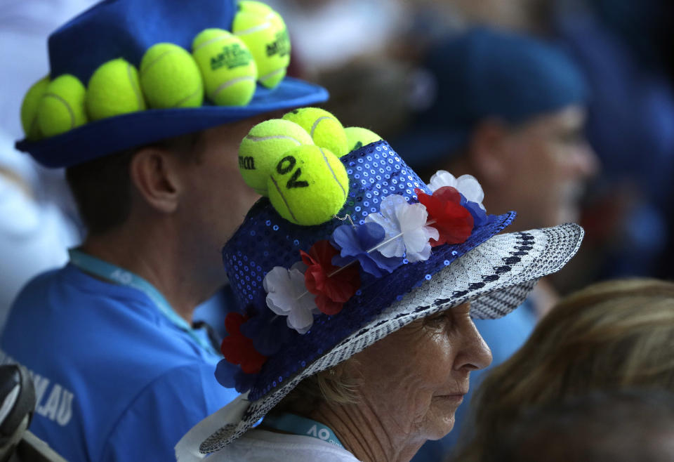 Spectators watch the quarterfinal match between Canada's Milos Raonic and France's Lucas Pouille at the Australian Open tennis championships in Melbourne, Australia, Wednesday, Jan. 23, 2019. (AP Photo/Mark Schiefelbein)