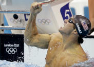 United States' Nathan Adrian celebrates his gold medal win in the men's 100-meter freestyle swimming final at the Aquatics Centre in the Olympic Park during the 2012 Summer Olympics in London, Wednesday, Aug. 1, 2012. (AP Photo/Matt Slocum)