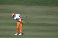 Rickie Fowler makes his second shot on the first hole during final round of the CJ Cup golf tournament, Sunday, Oct. 17, 2021, in Las Vegas. (AP Photo/David Becker)