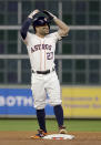 Houston Astros' Jose Altuve react after flying out due to fan interference during the first inning in Game 4 of a baseball American League Championship Series against the Boston Red Sox on Wednesday, Oct. 17, 2018, in Houston. (AP Photo/David J. Phillip)