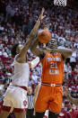 Indiana center Michael Durr (2) knocks the ball out of the hands of Illinois center Kofi Cockburn (21) as he attempts to shoot during the first half of an NCAA college basketball game, Saturday, Feb. 5, 2022, in Bloomington, Ind. (AP Photo/Doug McSchooler)