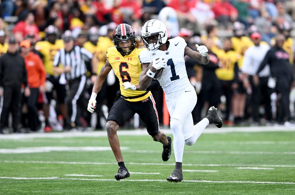 KeAndre Lambert-Smith of Penn (1) runs for yardage against Maryland last November. He and the rest of the Nittany Lions' receiving corps must improve in 2024.