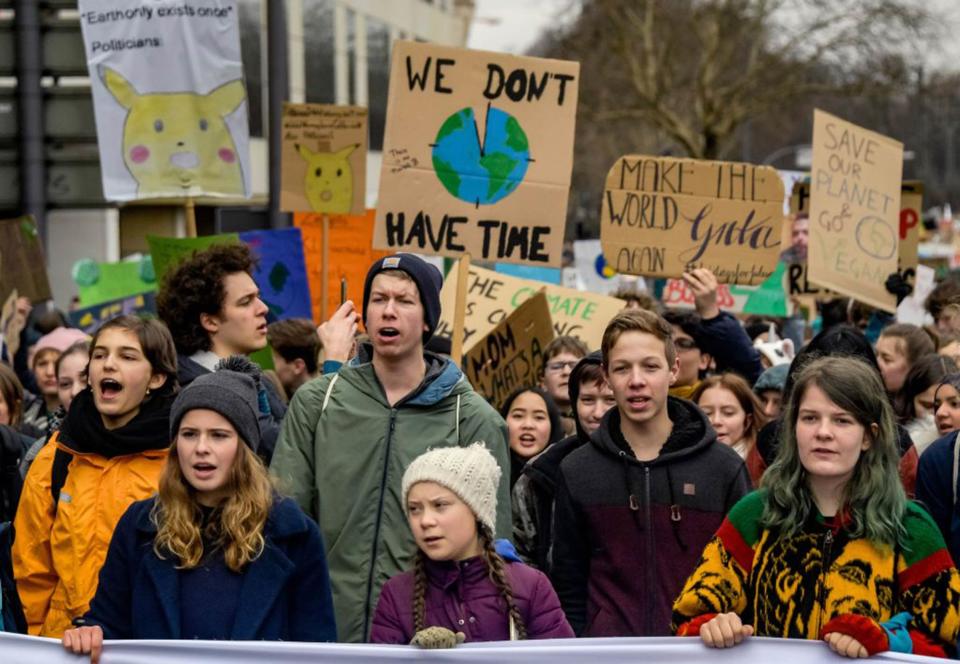 Swedish climate activist Greta Thunberg (C) takes part in a demonstration of students calling for climate protection on March 1, 2019, in front of the Hamburg City Hall in Germany.