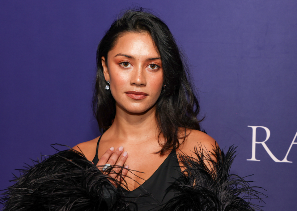 Luciane Buchanan in a black dress with feathers.