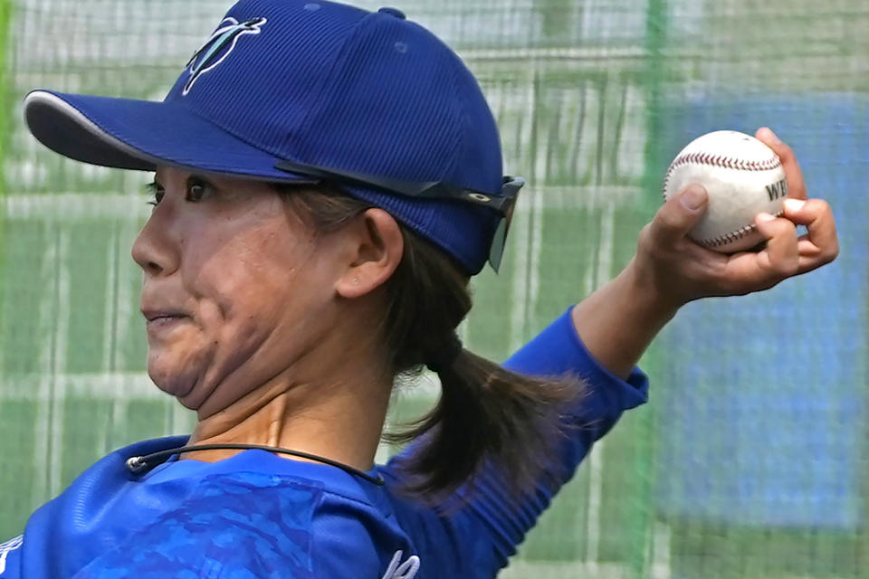 Eri Yoshida of a Japanese women's team, Agekke,throws a knuckleball as she plays catch during a practice in Oyama, Tochigi prefecture, north of Tokyo, Tuesday, May 30, 2023. The 31-year-old Japanese woman is a knuckleball pitcher with a sidearm delivery that she hopes might carry her to the big leagues in the United States or Japan. (AP Photo/Shuji Kajiyama)