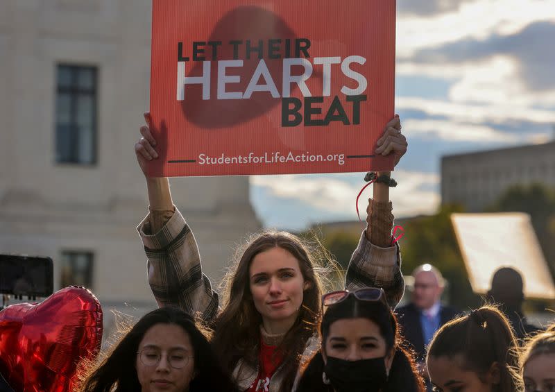 FILE PHOTO: Protestors demonstrate outside U.S. Supreme Court as the court weighs Texas abortion law