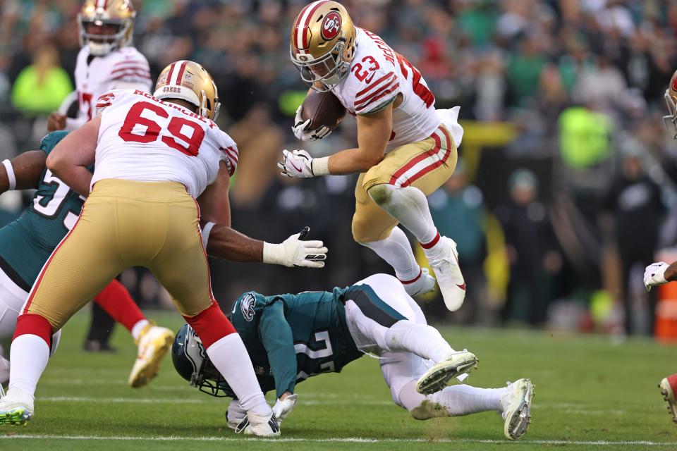 NFC championship game: San Francisco 49ers running back Christian McCaffrey (23) leaps over Philadelphia Eagles safety Marcus Epps (22) on way to a 23-yard touchdown run during the second quarter.