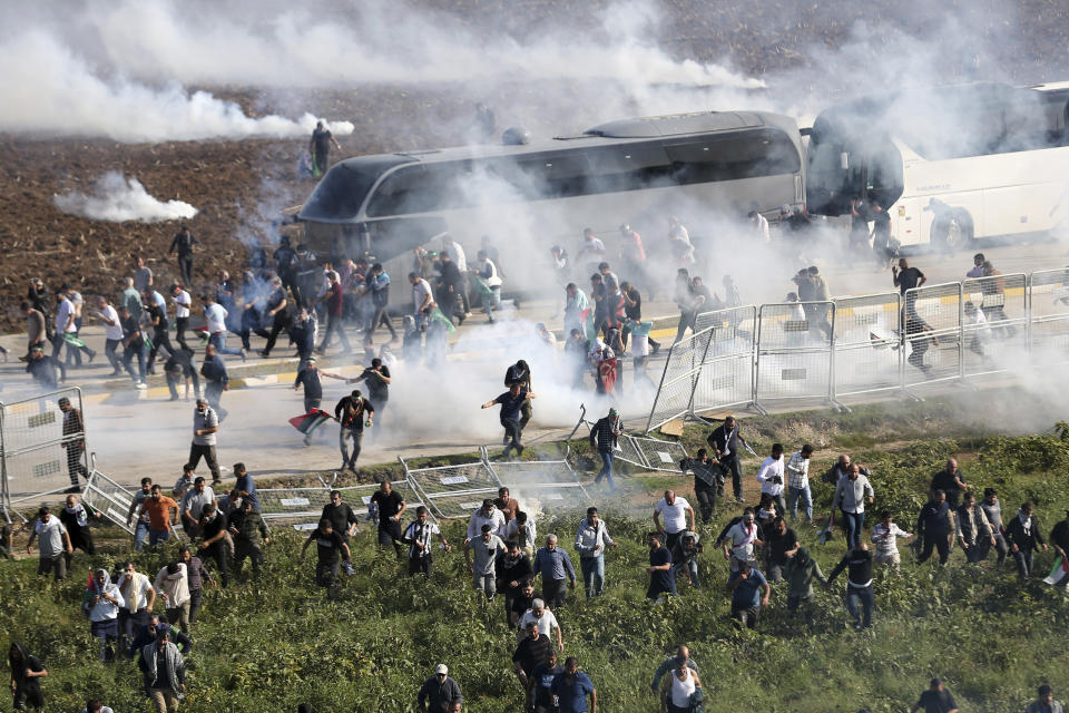 FILE - People clash with anti riot Turkish police officers during a pro Palestinian protest outside U.S. - Turkish Incirlik military air base in Adana, southern Turkey, on Nov. 5, 2023. (AP Photo/Mehmet Sancakzade, File)