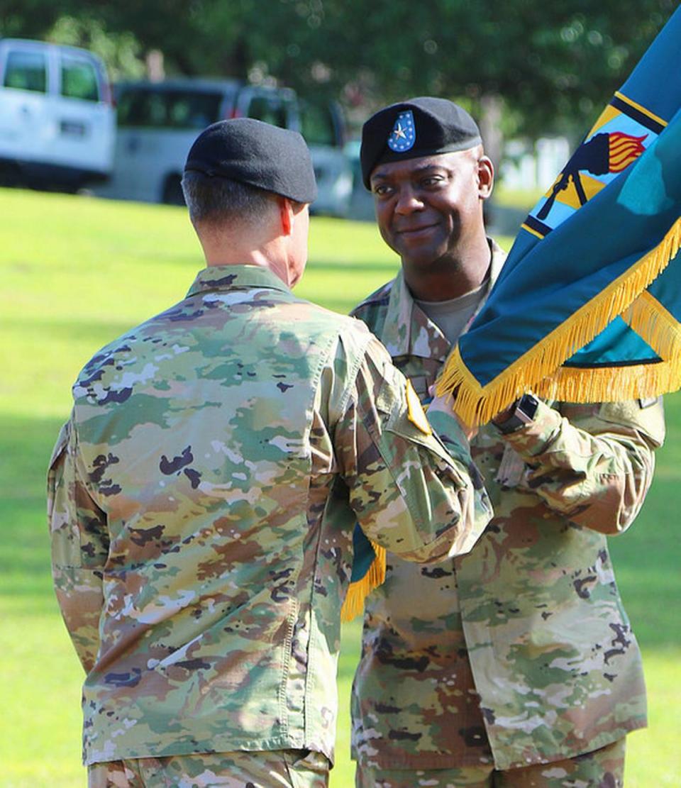 Brig. Gen. Milford ‘Beags’ Beagle Jr., Fort Jackson and Army Training Center commander, receives the unit colors from Maj. Gen. Malcolm Frost, commander of the Center for Initial Military Training, on Friday during a change of command ceremony at Victory Field on Fort Jackson.