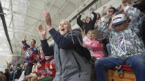 Julie Brian, center, of Layton, Utah, celebrates as the Ogden Mustangs score against the Utah Outliers during the Mountain Division Championship game Wednesday, April 17, 2024, in West Valley City, Utah. It may look like an NHL team has just fallen into Salt Lake City's lap. But local organizers say the Arizona Coyotes' relocation to Utah is the product of a yearslong effort to beckon professional hockey and other elite sports to the capital city. (AP Photo/Rick Bowmer)