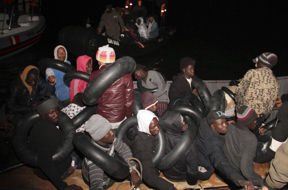 Migrants, mainly from sub-Saharan Africa, are stopped by Tunisian Maritime National Guard at sea during an attempt to get to Italy, near the coast of Sfax, Tunisia, Tuesday, April 18, 2023. The Associated Press, on a recent overnight expedition with the National Guard, witnessed migrants pleading to continue their journeys to Italy in unseaworthy vessels, some taking on water. Over 14 hours, 372 people were plucked from their fragile boats. (AP Photo)