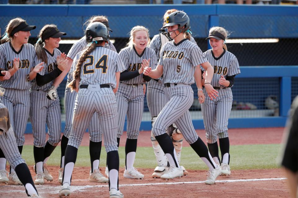 Caddo's Paityn Lowry runs home after hitting a home run during the Class 3A slowpitch softball state championship game between Caddo and Dale at USA Hall of Fame Stadium in Oklahoma City, Wednesday, May 3, 2023. 