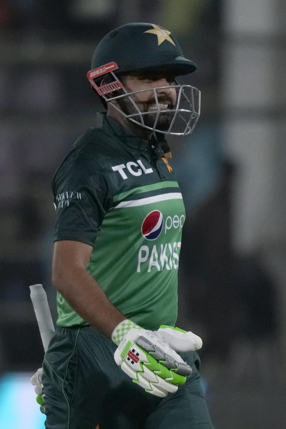 Pakistan's Babar Azam reacts as he walks off the field after his dismissal during the fifth one-day international cricket match between New Zealand and Pakistan, in Karachi, Pakistan, Sunday, May 7, 2023. (AP Photo/Fareed Khan)