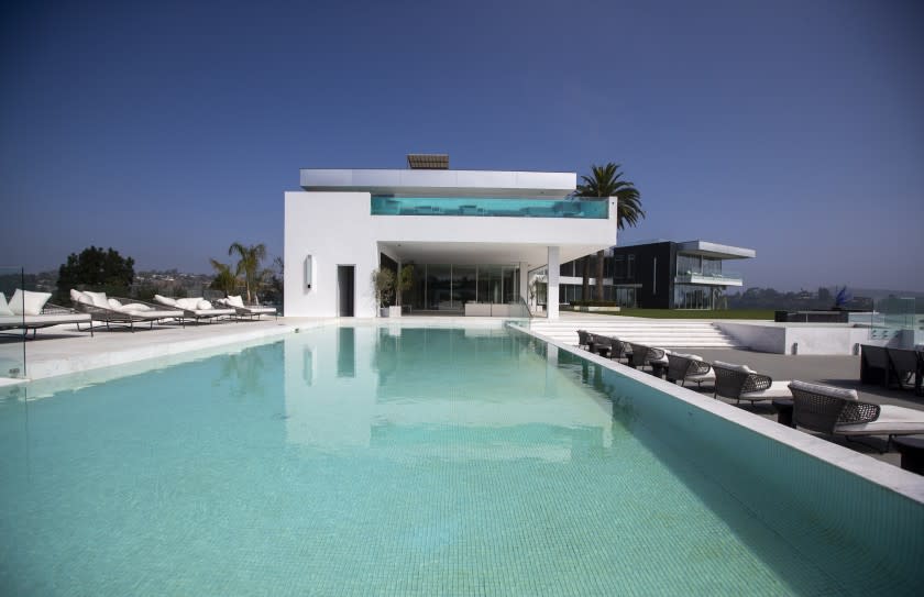 Beverly Hills, CA - September 08: A view of a pool with 4,000-square bedroom above with private pool at the "The One Bel Air", a 105,000-square-foot mansion by Nile Niami of Skyline Development and designed by Paul McClean (McClean Design). The One is shown by court-appointed receiver Ted Lanes, who now controls the property and is in charge of finding a buyer and paying off the lenders and other creditors, gives a tour of The One, the 105,000 square foot house on sale in Bel Air. This is apparently the largest home for sale in the United States. The developer Nial Niami "listed" it for $500 million but got into financial trouble and was foreclosed upon by Don Hankey. Photo taken in Bel Air on Wednesday, Sept. 8, 2021 in Beverly Hills, CA. (Allen J. Schaben / Los Angeles Times)