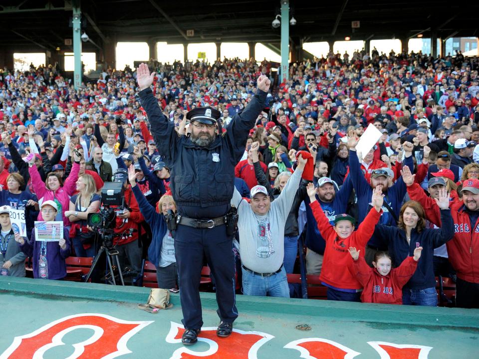 Boston police officer Steve Horgan poses for a photo inside of Fenway Park prior to the World Series parade in 2013.
