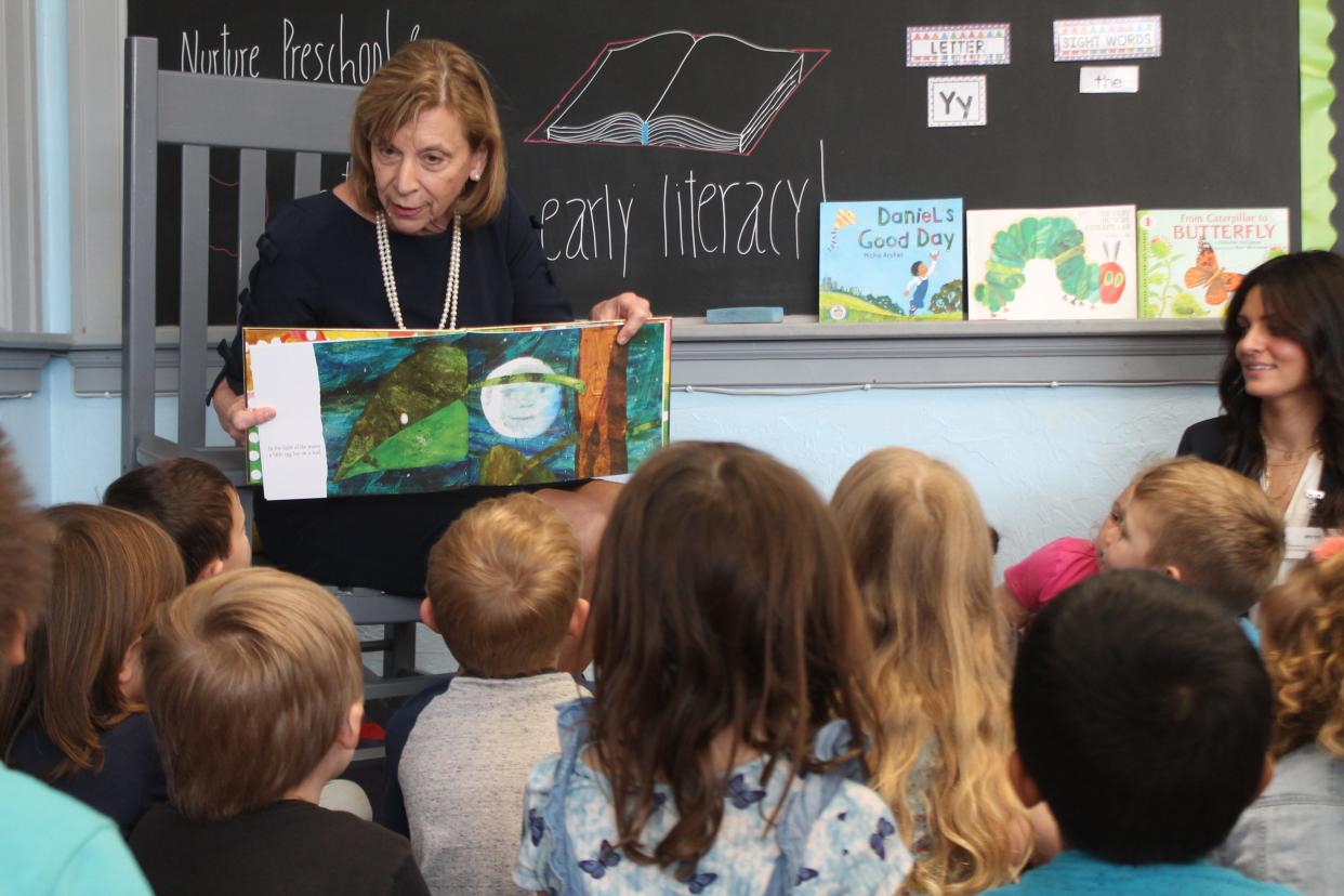 Ohio First Lady Fran DeWine reads "The Very Hungry Caterpillar" to preschool students at Nurture Preschool and Childcare in Byesville.