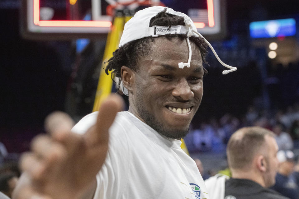 Akron's Sammy Hunter celebrates after a victory over Kent State in an NCAA college basketball game in the championship of the Mid-American Conference tournament, Saturday, March 16, 2024, in Cleveland. (AP Photo/Phil Long)