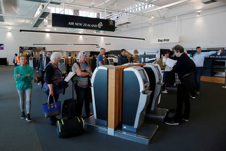 Air New Zealand passengers check-in during fuel shortages at Auckland Airport in New Zealand, September 20, 2017. REUTERS/Nigel Marple