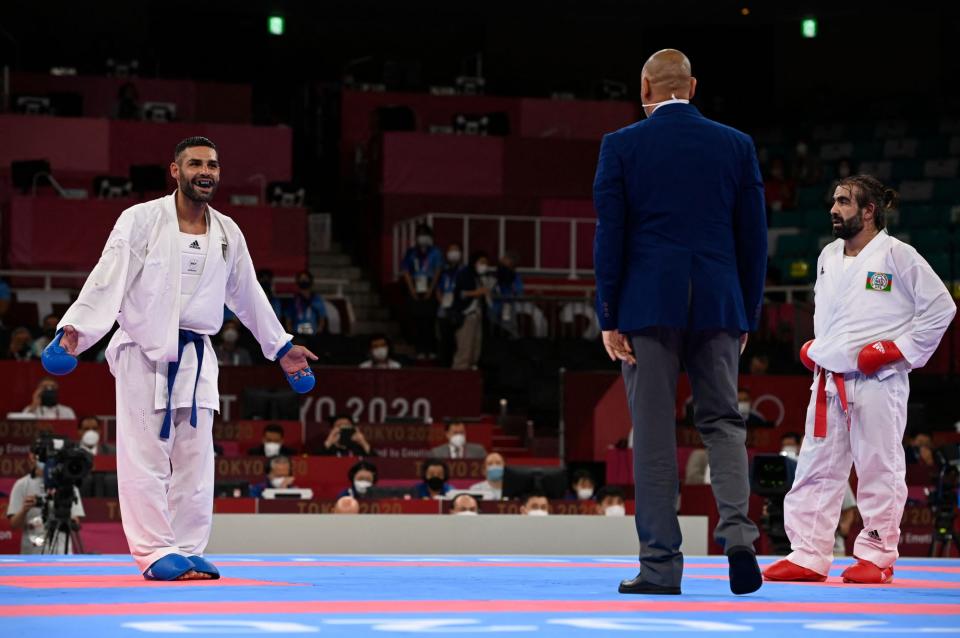 <p>Italy's Luigi Busa reacts to winning the gold medal in the Men's Kumite -75kg karate competition. </p>