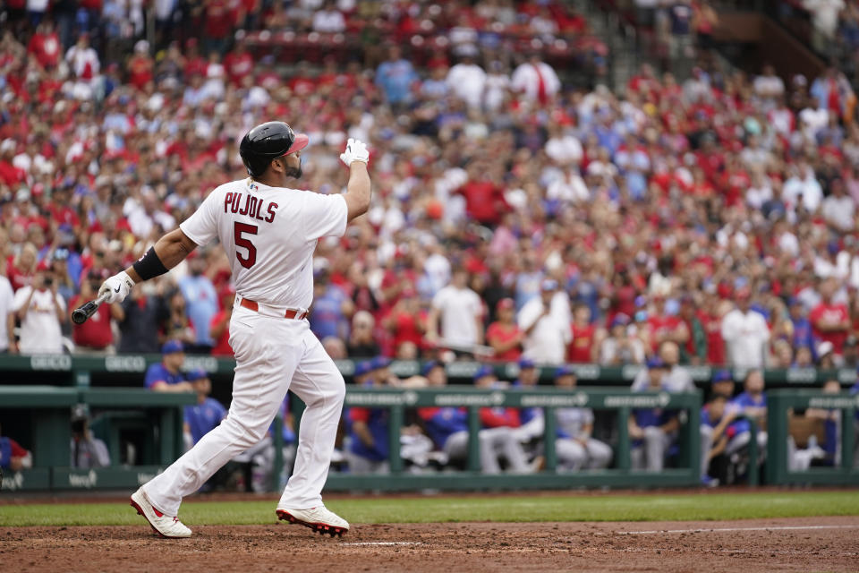 St. Louis Cardinals' Albert Pujols watches his two-run home run during the eighth inning of a baseball game against the Chicago Cubs Sunday, Sept. 4, 2022, in St. Louis. (AP Photo/Jeff Roberson)