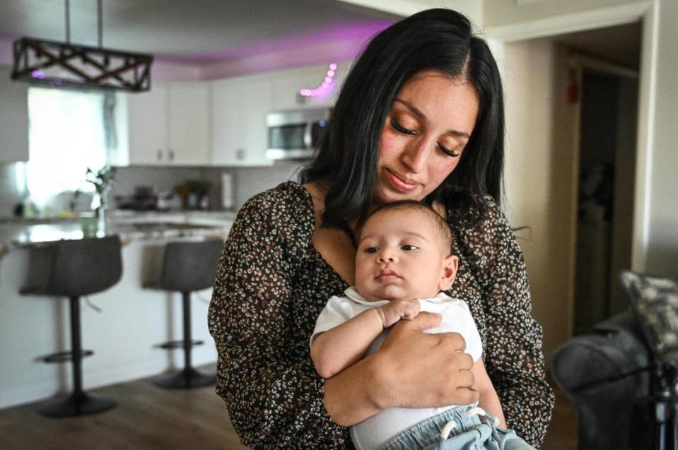 Karla Alvarez holds her baby son, Maximus Gonzalo Carrasco, the son of fallen Selma police officer Gonzalo Carrasco Jr, at her home in Dinuba on Tuesday, May 9, 2023. Baby Max was born just about a month after his father was murdered in the line of duty last January 31, 2023. CRAIG KOHLRUSS/ckohlruss@fresnobee.com