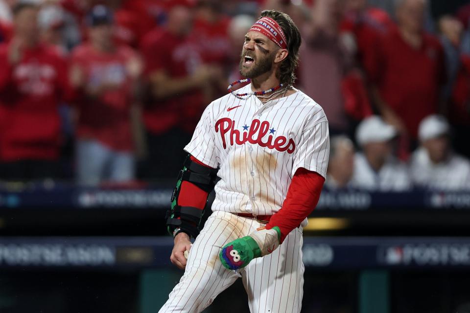 Bryce Harper celebrates after scoring a run in the eighth inning.