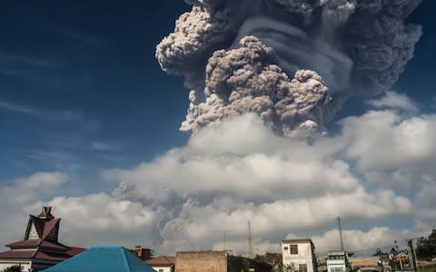 Mount Sinabung erupts thick volcanic ash in Karo on Sumatra island on February 19, 2018. - Credit: TIBTA PANGIN/Source: AFP