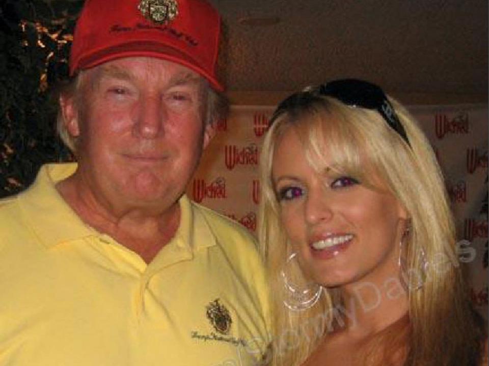 An evidence photo from Donald Trump's hush money trial in New York, showing him with his arm around Stormy Daniels during a 2006 celebrity golf tournament in Lake Tahoe.  Daniels says this photo was taken in his hotel suite hours before they had sex.