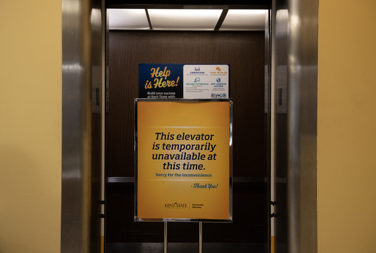 A sign warns a library elevator is out of order at Kent State University. The university could get millions in state money to fund elevator modernization.