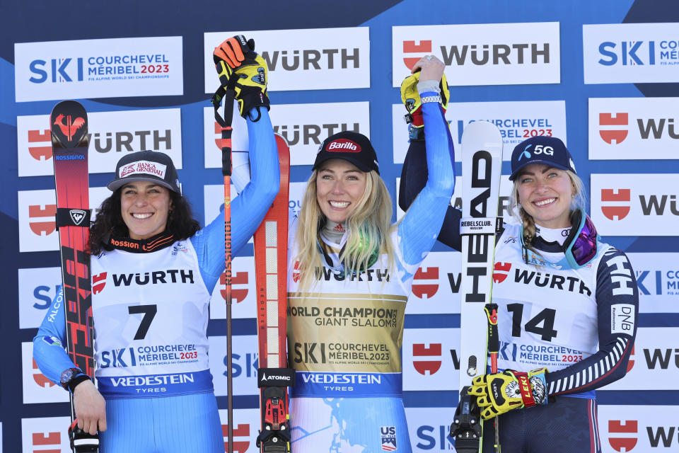 United States' Mikaela Shiffrin, center, gold medalist in an alpine ski World Championships giant slalom, celebrates with silver medalist Italy's Federica Brignone, left, and bronze medalist Norway's Ragnhild Mowinckel, in Meribel, France, Thursday, Feb. 16, 2023. (AP Photo/Marco Trovati)