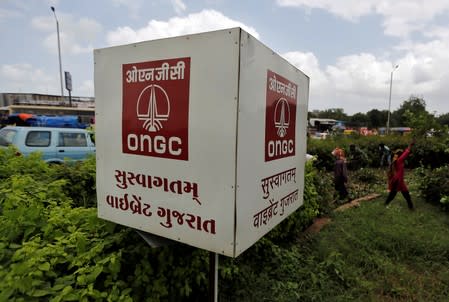 FILE PHOTO: The logo of Oil and Natural Gas Corp's (ONGC) is pictured along a roadside in Ahmedabad