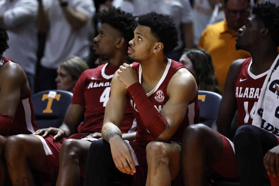 Alabama guard Dominick Welch (10), forward Noah Gurley (4), and center Charles Bediako (14) watch play in the final seconds of the second half of an NCAA college basketball game against Tennessee, Wednesday, Feb. 15, 2023, in Knoxville, Tenn. (AP Photo/Wade Payne)