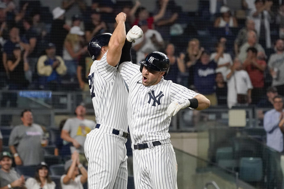 New York Yankees' Joey Gallo, right, celebrates his three-run home run with Giancarlo Stanton during the seventh inning of the team's baseball game against the Seattle Mariners, Thursday, Aug. 5, 2021, in New York. (AP Photo/Mary Altaffer)