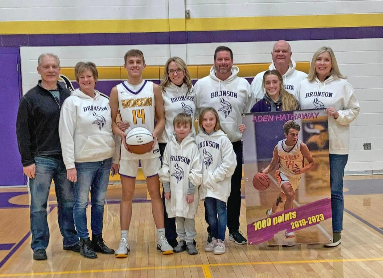 Bronson senior Aden Hathaway, shown here with his family, scored his 1000th career point in the Vikings win over Springport on Friday